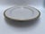 A single antique oval porcelain serving platter with gold greek key style border by O&EG Royal Austria.