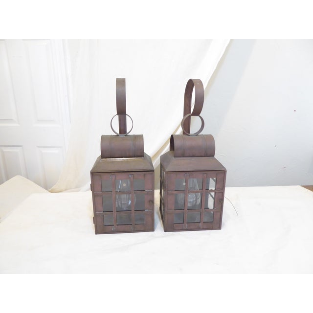 This pair of solid copper lantern sconces use up to 75 Watt Edison base bulbs. They ship with the glass removed. They have...