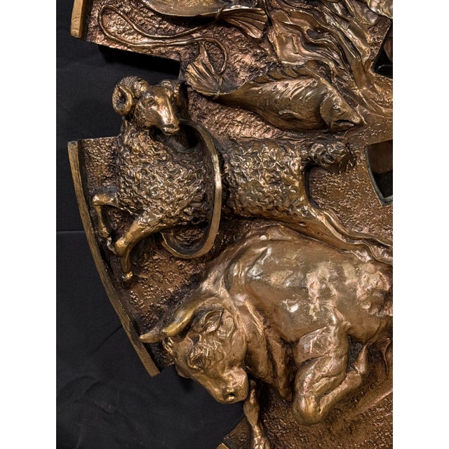 This large circular gold zodiac mirror by Finesse Originals is one of the more dramatic wall pieces of its era. Twelve...