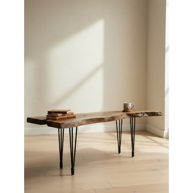 This one-of-a-kind coffee table is handcrafted from a striking solid slab of black walnut, selected for its rich natural...