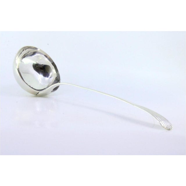 Plain Silver Soup Ladle with Embossed Handle, in Very Good conditions. Designed before 1890 This piece has an attribution...