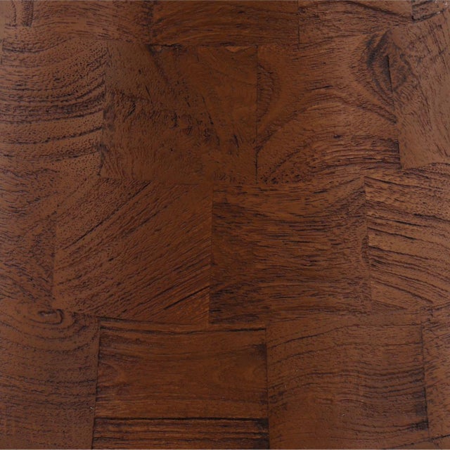 Rich brown finish mango wood side table with round top and pedestal base. Subtle patchwork style design. Each will vary in...