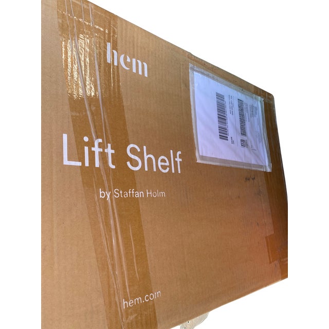 a complete set of four Hem Lift 3 shelves in black — designed by Swedish designer Staffan Holm for Hem, Stockholm. Three...