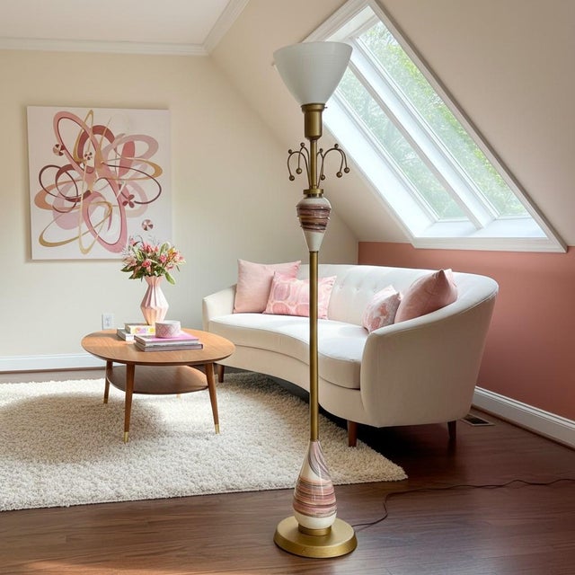 A playful atomic-era Sputnik floor lamp, embodying the optimistic space-age design that defined mid century modern...