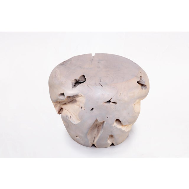 Inspired by the beauty of natural root form, this organic teak accent side table is handcrafted from one piece of salvaged...