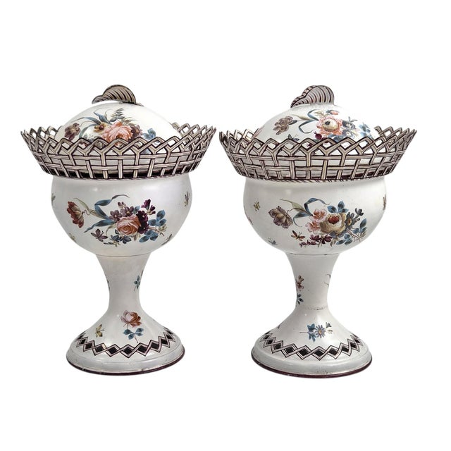 An outstanding pair of French Empire period tole peinte chestnut urns from the early 19th century, offering a brilliant...
