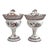 An outstanding pair of French Empire period tole peinte chestnut urns from the early 19th century, offering a brilliant...