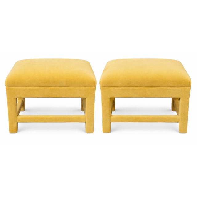A stylish pair of Postmodern Parsons-style ottomans, newly upholstered from top to bottom in a rich golden-yellow fabric....
