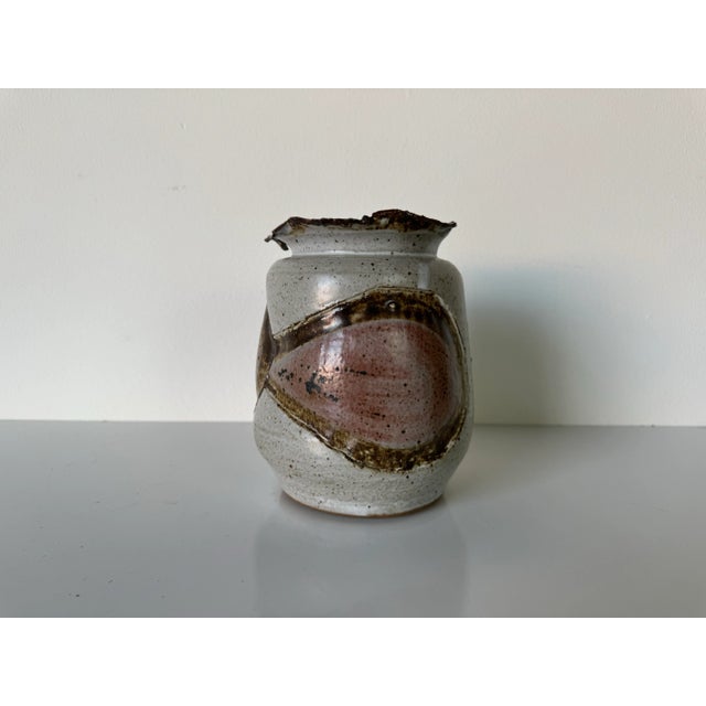 An incredible Mid-century brutalist organic spackle glaze art studio pottery vase. This hand formed swollen slab built...