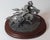 Western Sculpture of a Soldier and Indian riding face to face, (eye to eye). Sculptured for the Chilmark Brand, by Donald...