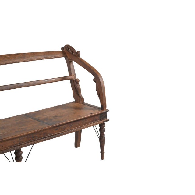 This Antique Indian Teakwood Bench is handcrafted from solid teakwood, and of unusual design excellence and quality....