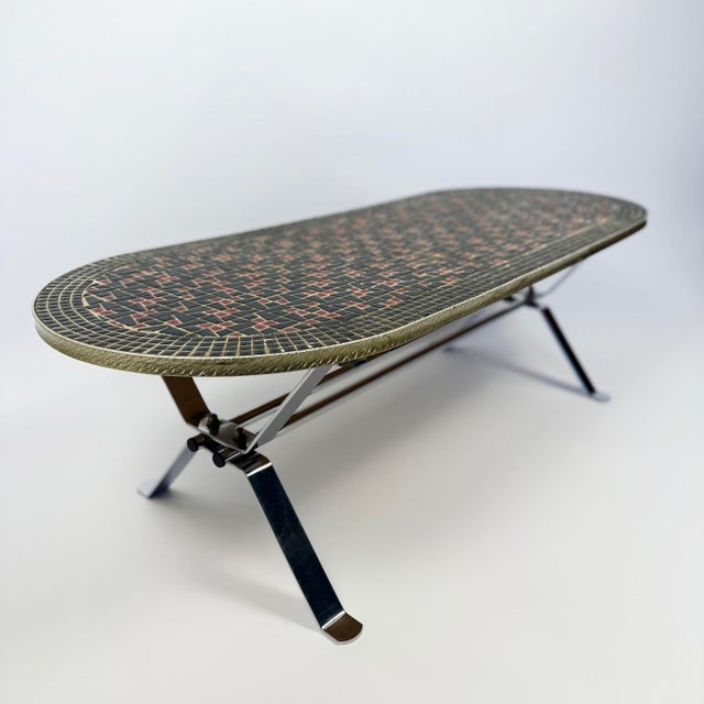 This 1960s coffee table combines an elegant mosaic table top on a robust chrome frame. Crafted in the 1960s in belgium, it...