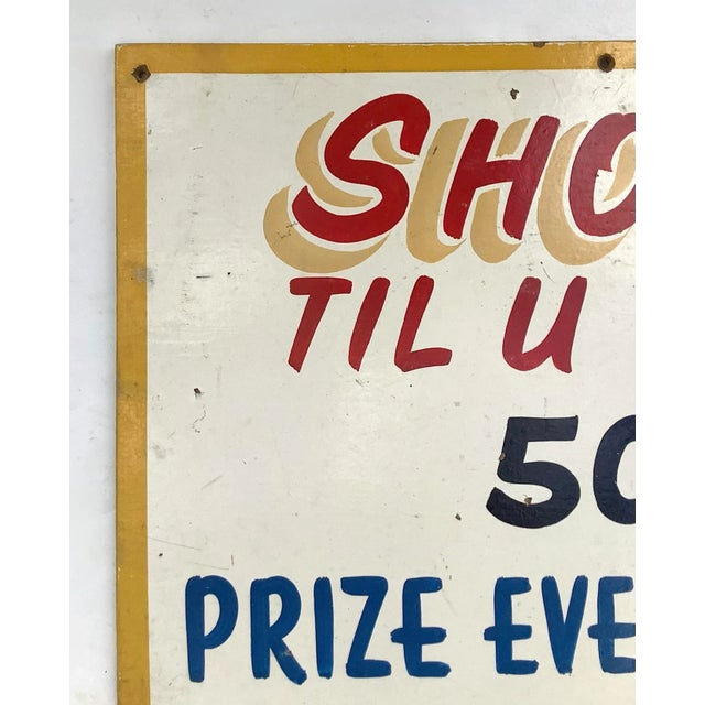 Circa 1940s/50s hand painted on masonite colorful carnival sign. Sign is one sided, has some discolorations, holes where...