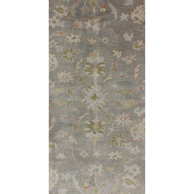 Muted hand knotted Oushak Rug, Keivan Woven Arts/rug , country of origin / type: India / Oushak, circa Early-21st Century....