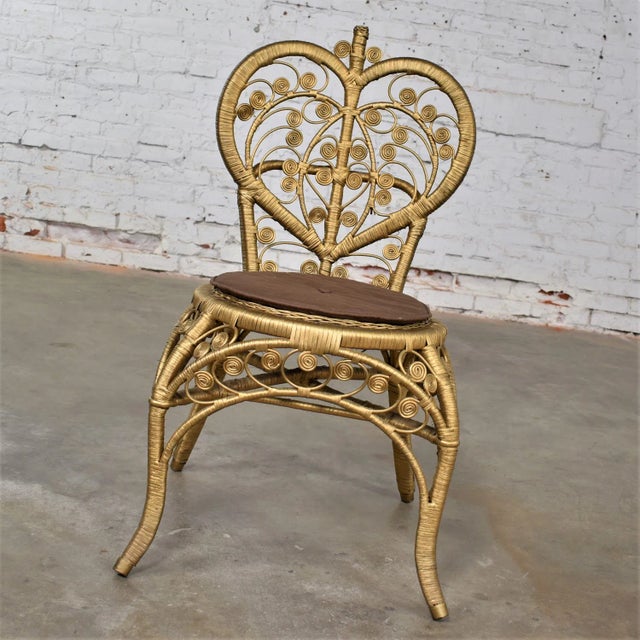 Lovely vintage Hollywood Regency Bohemian gold painted wicker side or accent chair with heart shaped back. Beautiful...