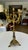 Single 1920s Gothic Revival brass candelabra featuring a six-light branch configuration and an ornate tri-form footed base.