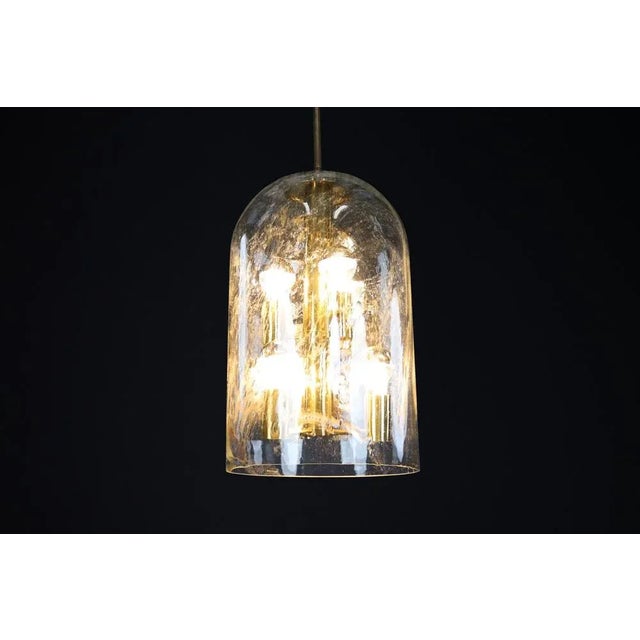 Iconic doria leuchten smoked glass and brass pendant light, germany, 1970s this exceptional ample pendant light was...