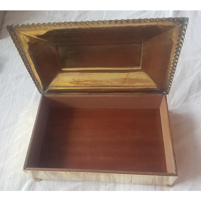 Cigarette / cigar box made of brass and wood. Odorless, probably unused. This piece has an attribution mark, I am sure...