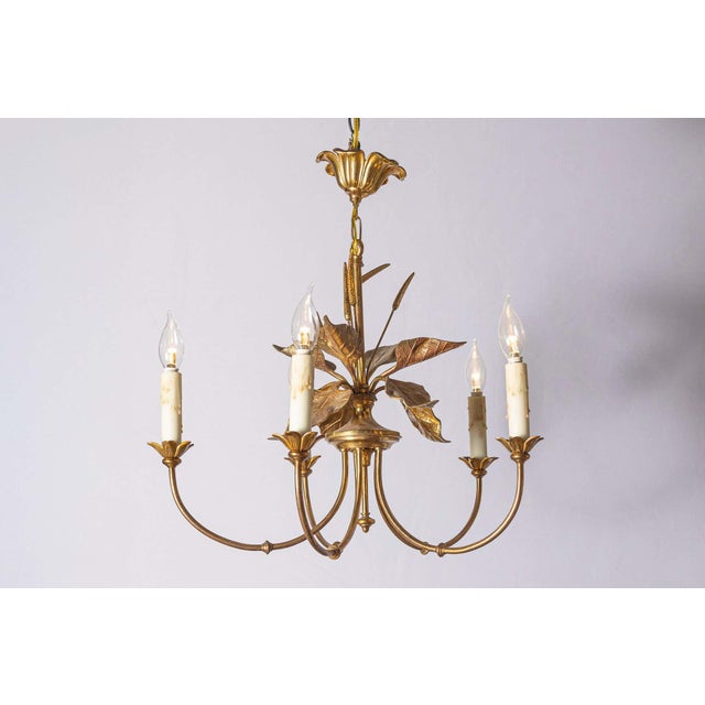 This stunning 20th-century French chandelier draws inspiration from the elegant designs of Maison Charles. The centerpiece...