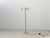 Elegant three-light vintage floor lamp with a finely crafted brass frame and a distinctive twisted central stem. The...