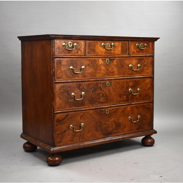 A fine George III period burr walnut chest of drawers dating from the late 18th century, beautifully veneered in richly...