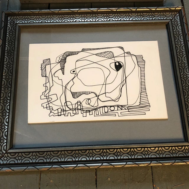 2 uneven ink drawings on paper laid down on mat board 1 signed overall size with vintage frames is 10 x 12 they are on the...