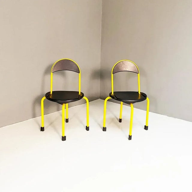 Folding plastic and metal seats by Lamm, 1980s. Folding seats with structure in yellow painted metal tubing and round seat...