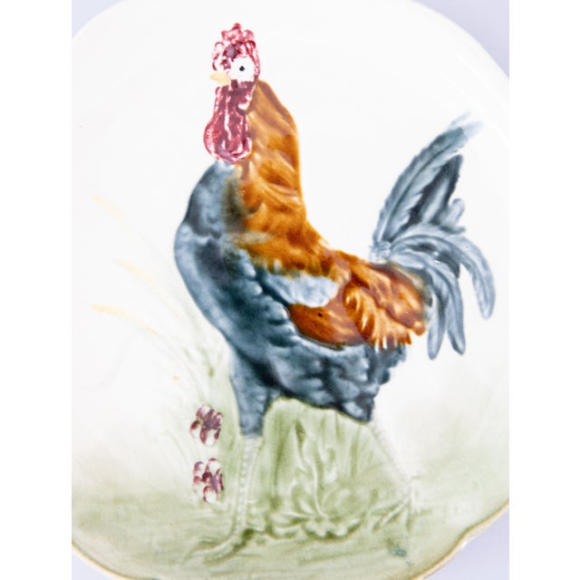 A charming antique French majolica rooster plate by H.B. Boulanger, Choisy le Roi, France, circa 1890. Maker's mark on...
