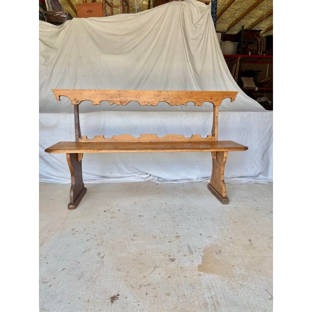 Found in Italy, this 19th Century Italian Pine Frattino Design Bench dates back to the 1800's. The piece features a...