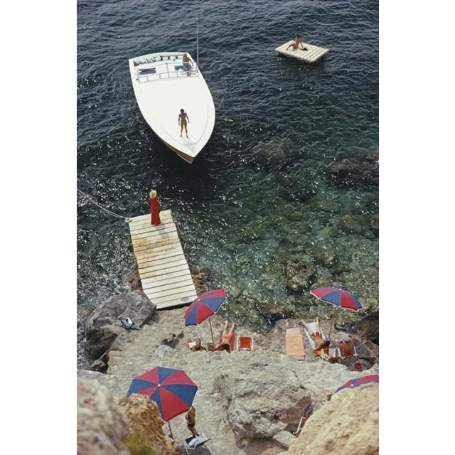 Coming Ashore 1973 by Slim Aarons Slim Aarons Limited Estate Edition A Magnum motorboat belonging to Count Filippo...