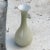 This vase is made in glass in Oplaline. It has been made in Italy in the 1960s. It is a green color.