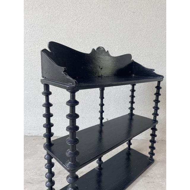 Three-tier spool shelf inspired by the Napoleon III period. Authentic antique piece of turned wood furniture. Solid wood,...