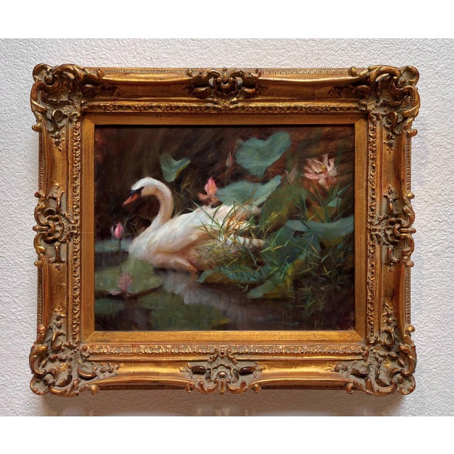 This oil painting depicts a serene scene of a swan gracefully nestled among vibrant lilies, surrounded by lush greenery....