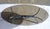 Oval coffee table with a 12mm bronze smoked glass top on a solid chromed steel base. The entire piece is in perfect...