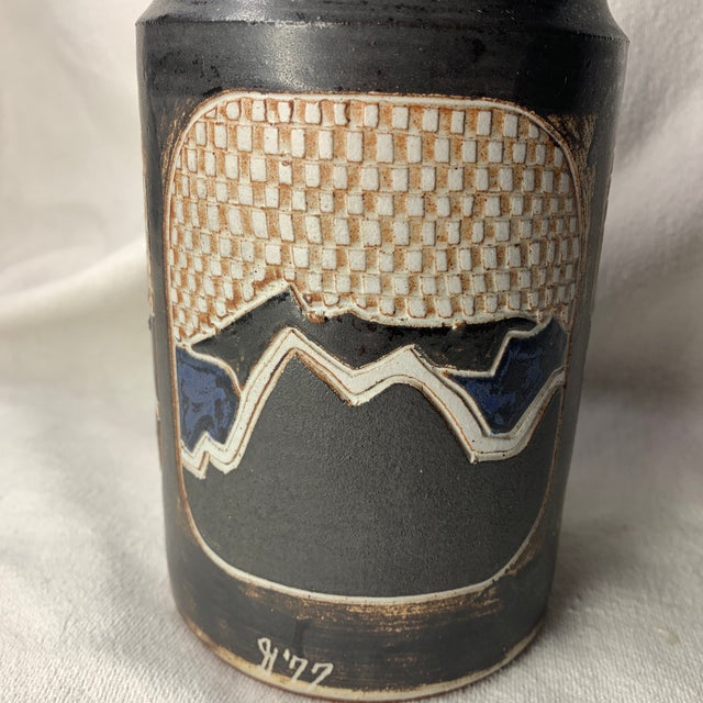 This beautiful studio art pottery cylinder vessel features highly detailed, stylized mountain landscape panels. The...