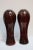 Beautiful, large matched pair of mid-century Murano glass vases. Expertly crafted in shades of crimson with avventurina...