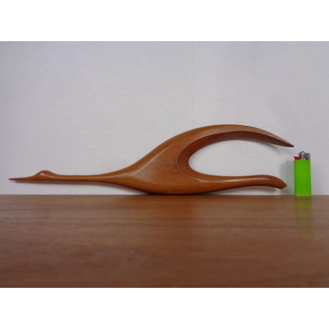 Two large herons made of teak from the 1960s.