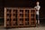 Low-profile oak cabinet fitted with six glass-paneled doors and interior shelving. Crafted in solid oak with a deep, warm...