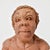 A female figure with a fish hand modeled with earthenware terracotta clay from Malawi. Fired naturally with a raku...