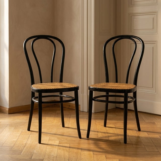 Pair of bentwood chairs with black lacquered beech frames and Vienna straw seats, Herbatschek series, produced at a former...