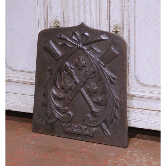 Crafted in France circa 1870, this antique heraldic wall shield is cast in solid iron and modeled in high relief with a...