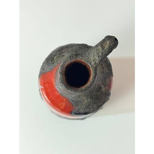 This small carafe vase from Marei Keramik is a vibrant piece of design history and a prime example of the expressive style...