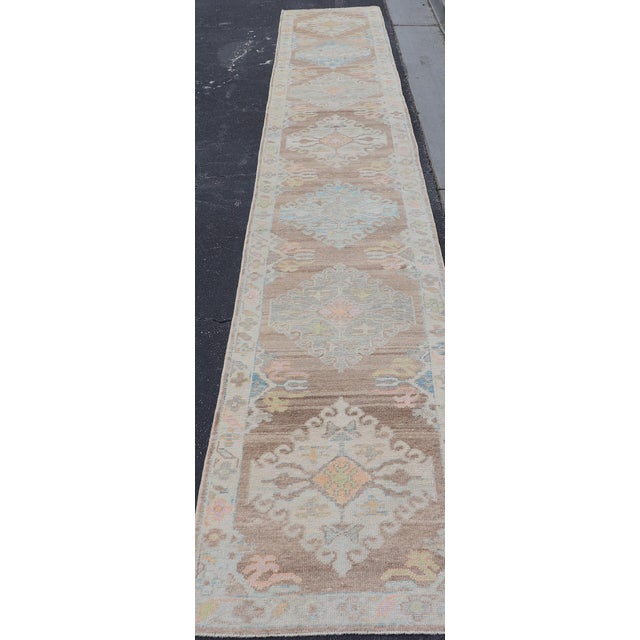 Long Turkish Oushak Runner With Pale Blue, Soft Yellow, and Light Brown Motifs For Sale - Image 13 of 13