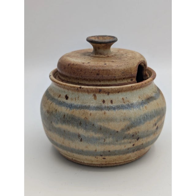 This Vintage Ceramic Lidded Pottery Sugar Bowl is a charming piece of stoneware handmade in the United States during the...