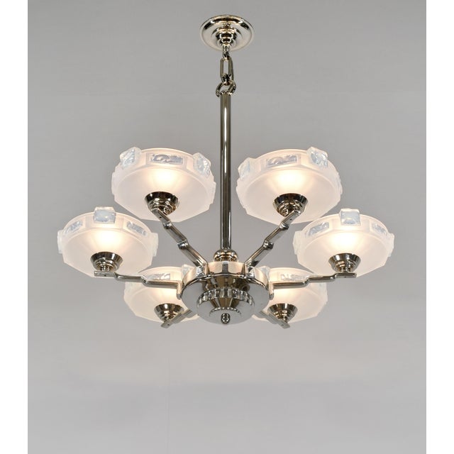 Henri Renon & Ezan A stunning 1930-1940 French art deco chandelier in nickel plated solid brass or bronze. It holds six...