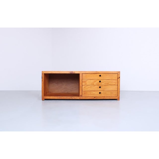 Very rare small sideboard by Ate van Apeldoorn. The natural pine highlights the wood grain, and the finger-jointed panels...