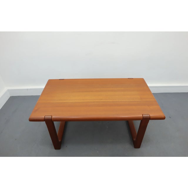 Coffee table designed by niels bach and manufactured in denmark in 1960's. Table top and frame made of solid teak wood....