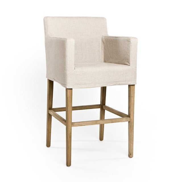 The Avignon Slipcover Bar Stool from Zentique features a removable natural linen slipcover on a natural oak frame. The...