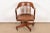 An exceptional Arts & Crafts, Mission, or Mid-Century Modern carved solid walnut executive swivel desk chair By Johnson...
