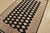 A tribal Bokhara Jaldar rug hand-knotted with fine wool on a cotton foundation. This rug features rows of repeating...